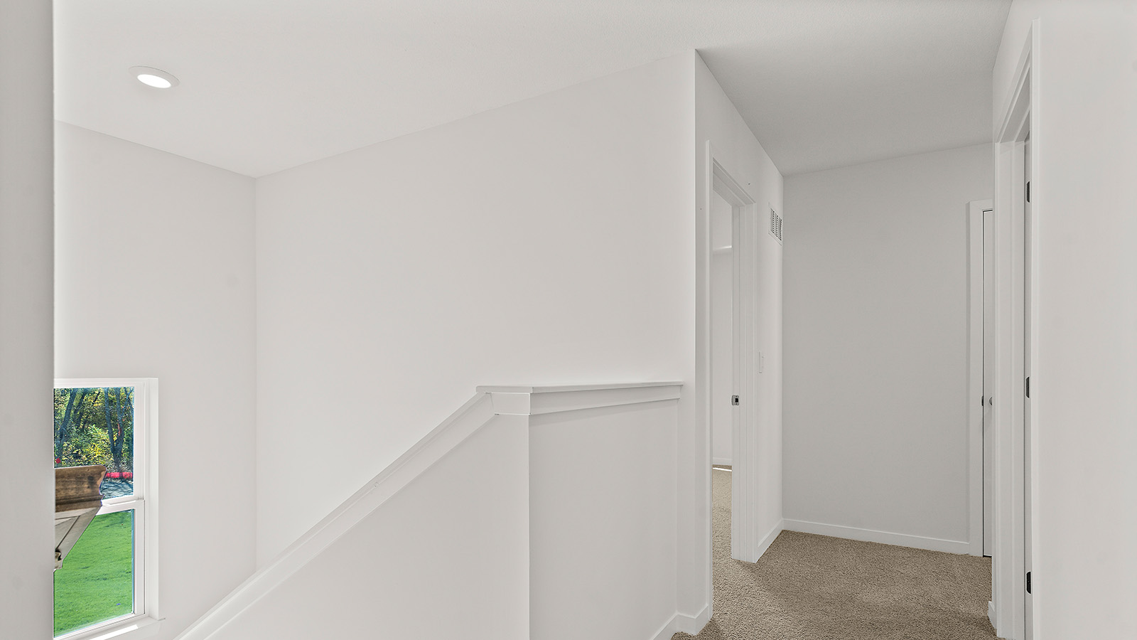 Carpeted Upstairs hallway. New Homes in Kansas City, Missouri