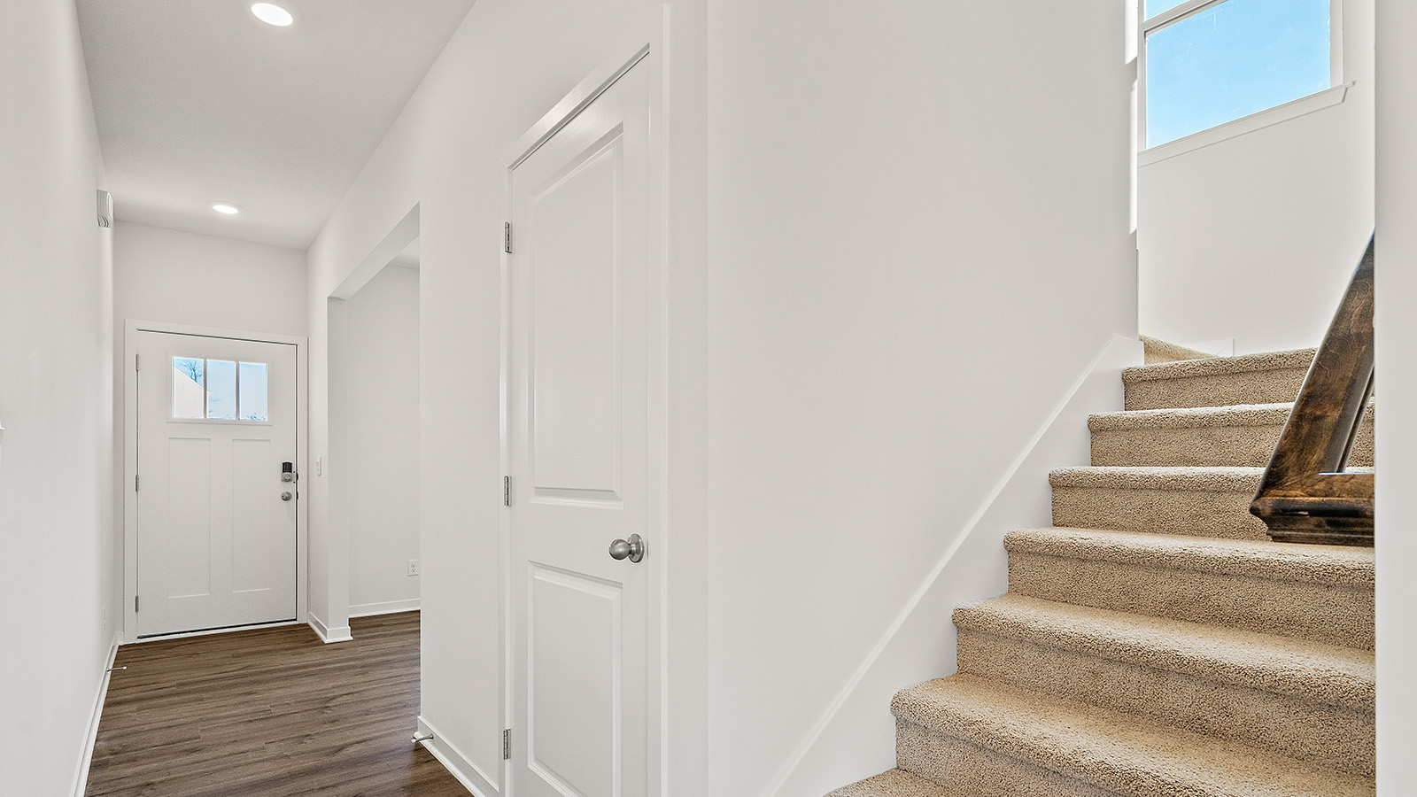 Welcoming foyer with view of staircase. New homes in Kansas City, Missouri