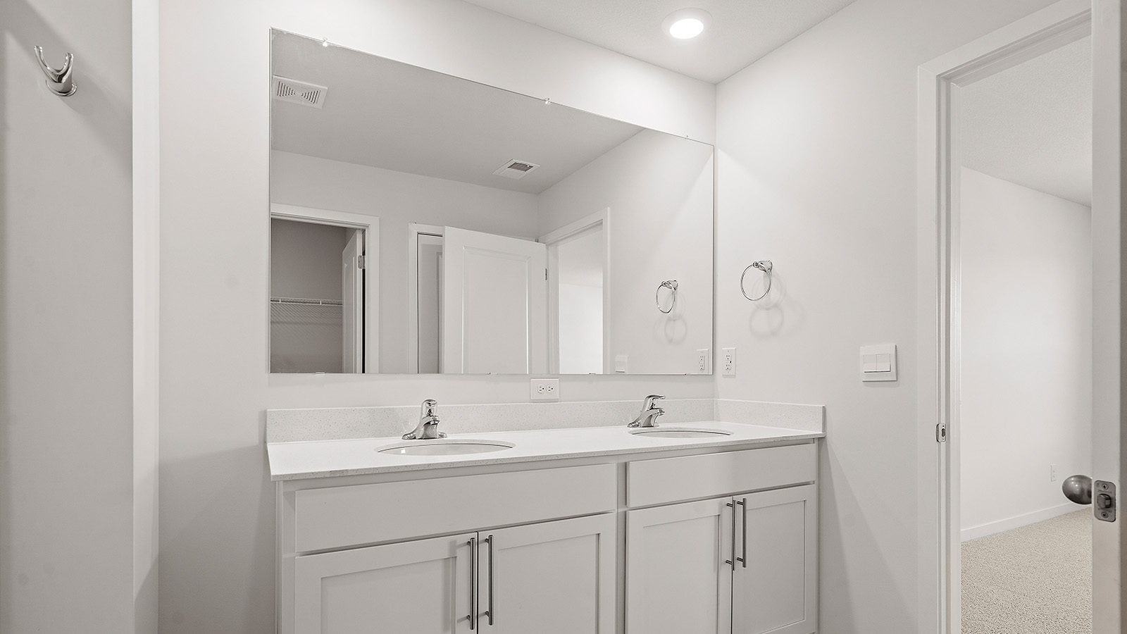 Primary bathroom with standing glass Door shower. New Homes in Kansas City, Missouri