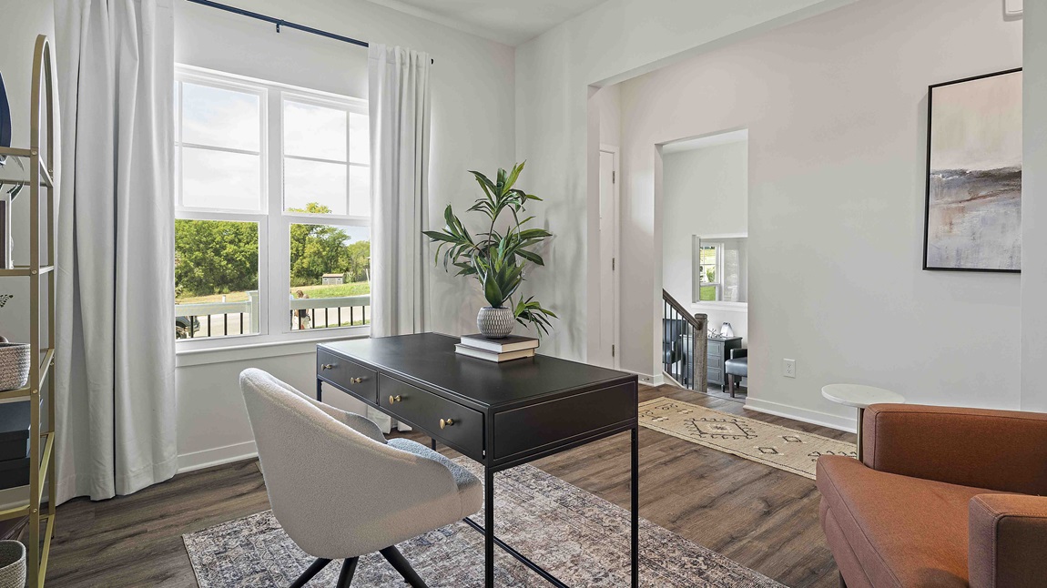 Flex office space with large window and vinyl floors