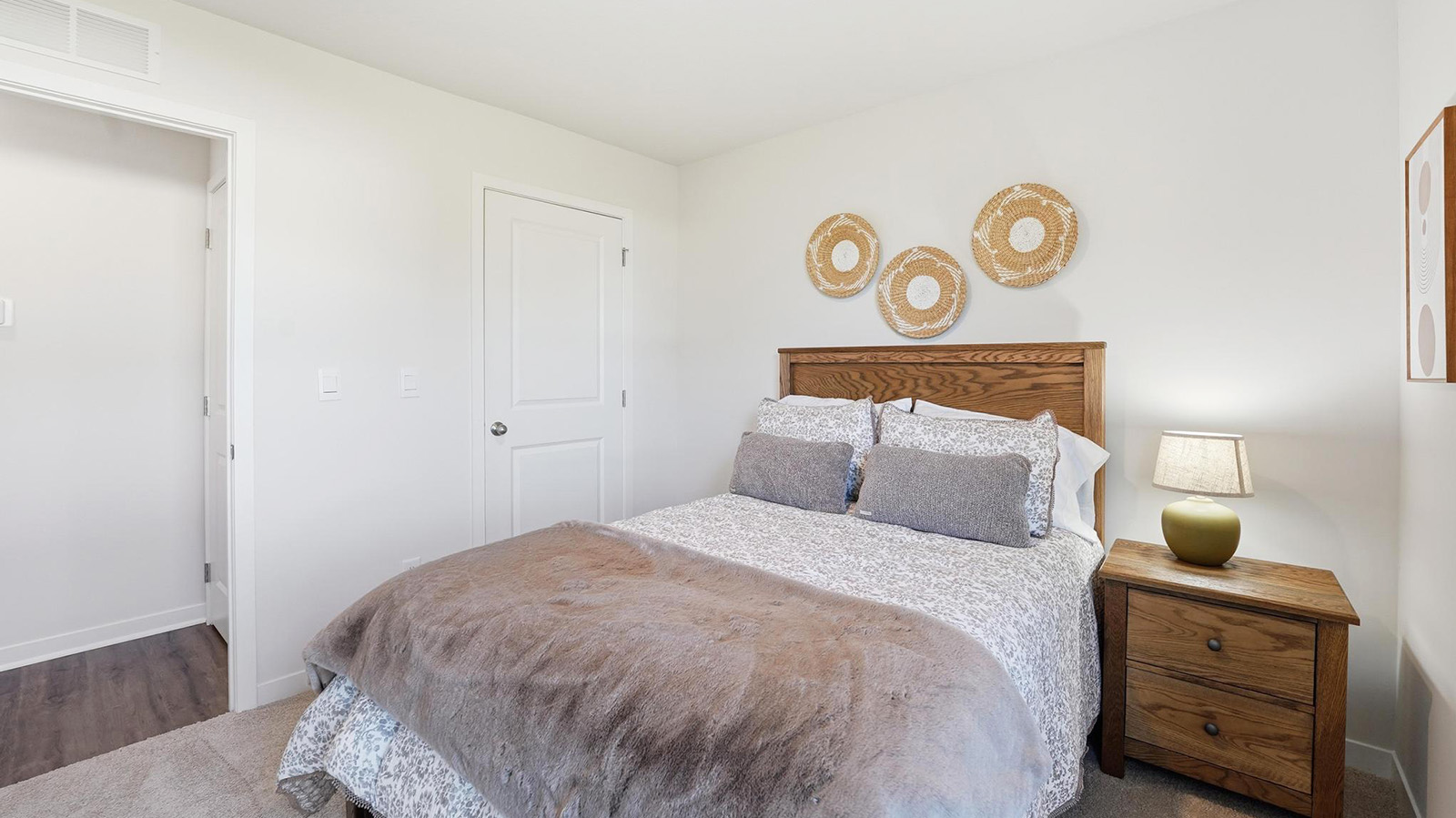 Carpeted bedroom with large windows