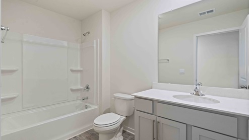 Bathroom with bathtub and shower combination