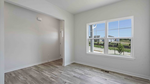 Welcoming foyer with view of dining room area with large window