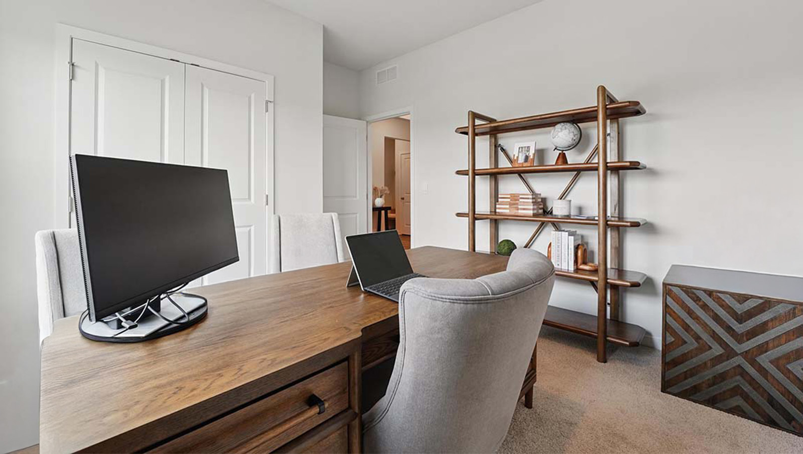 Carpeted Flex space/bedroom used as an office with large windows