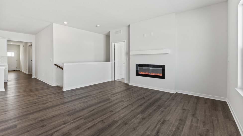 Living area with large windows and fireplace
