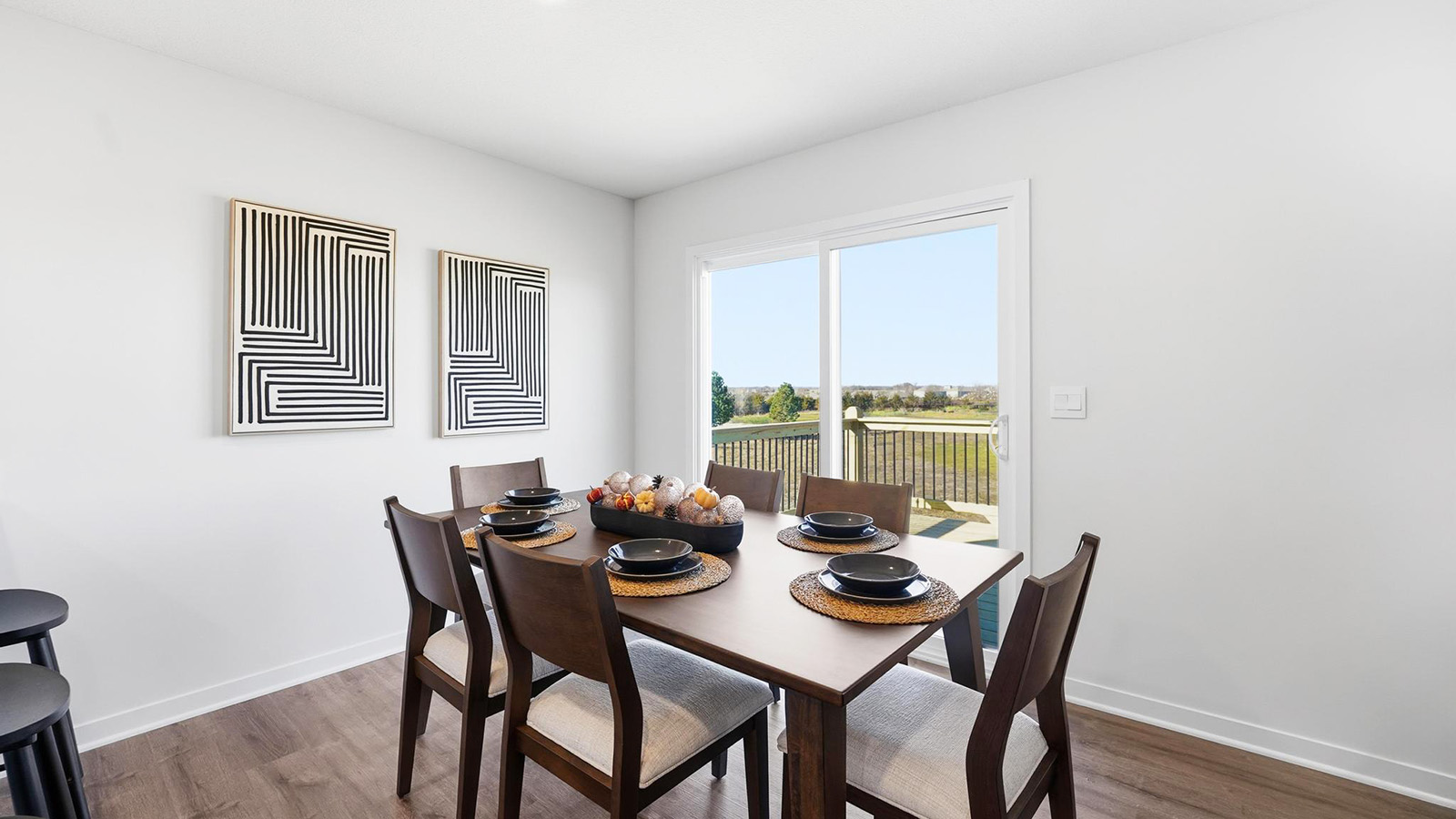 Dining area beside kitchen with sliding glass back door