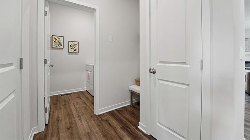 hallway view looking into the laundry room