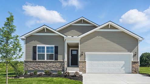 Front exterior of a home with a two car garage, blue and white siding and stone accents
