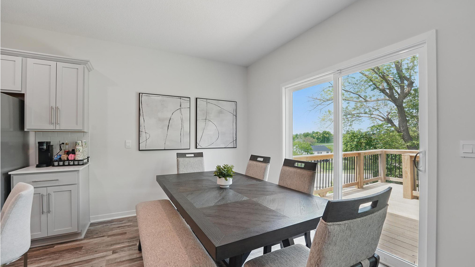 Dining area beside kitchen with sliding glass back door
