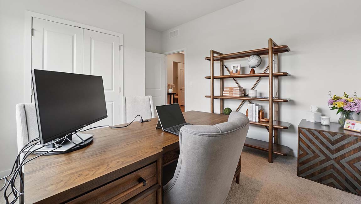 Carpeted bedroom with large windows