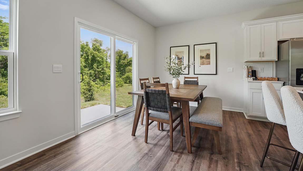 Dining area beside kitchen with sliding glass back door