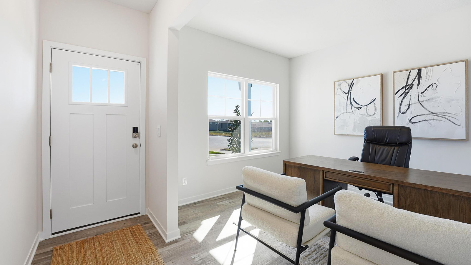 Welcoming foyer with view of flex space or office. New homes in Kansas City, Missouri