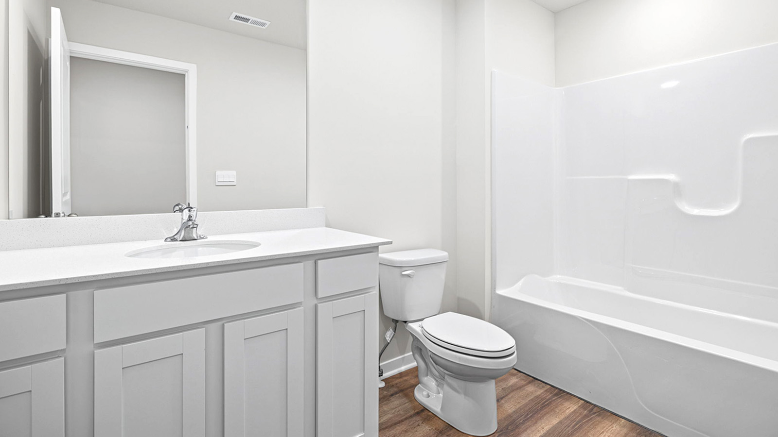 Bathroom with bathtub and shower combination.