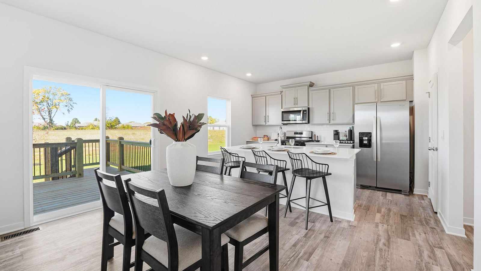 Dining area off of kitchen with large glass sliding door