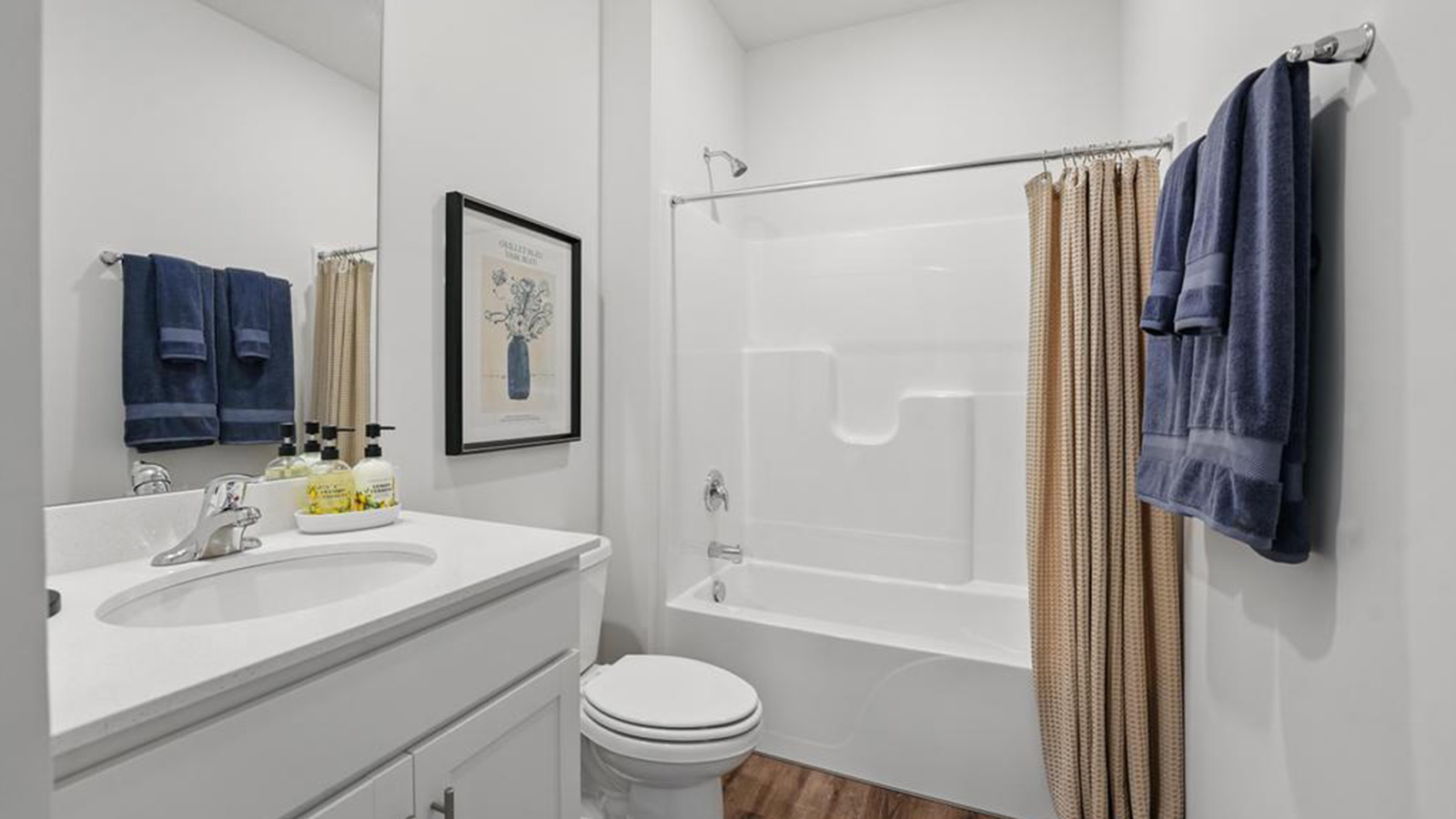 Bathroom with bathtub shower combination.