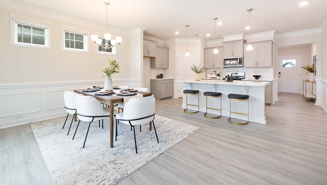 Arlington dining area beside kitchen and sliding glass doors