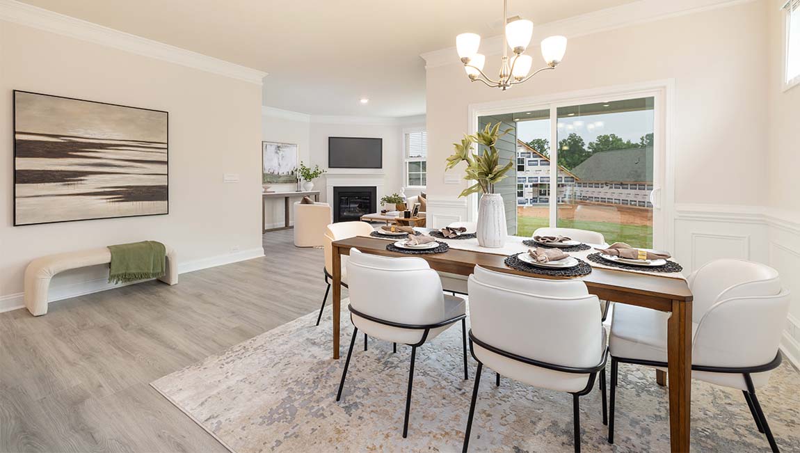 Arlington dining area beside kitchen and sliding glass doors