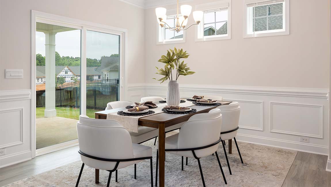 Arlington dining area beside kitchen and sliding glass doors