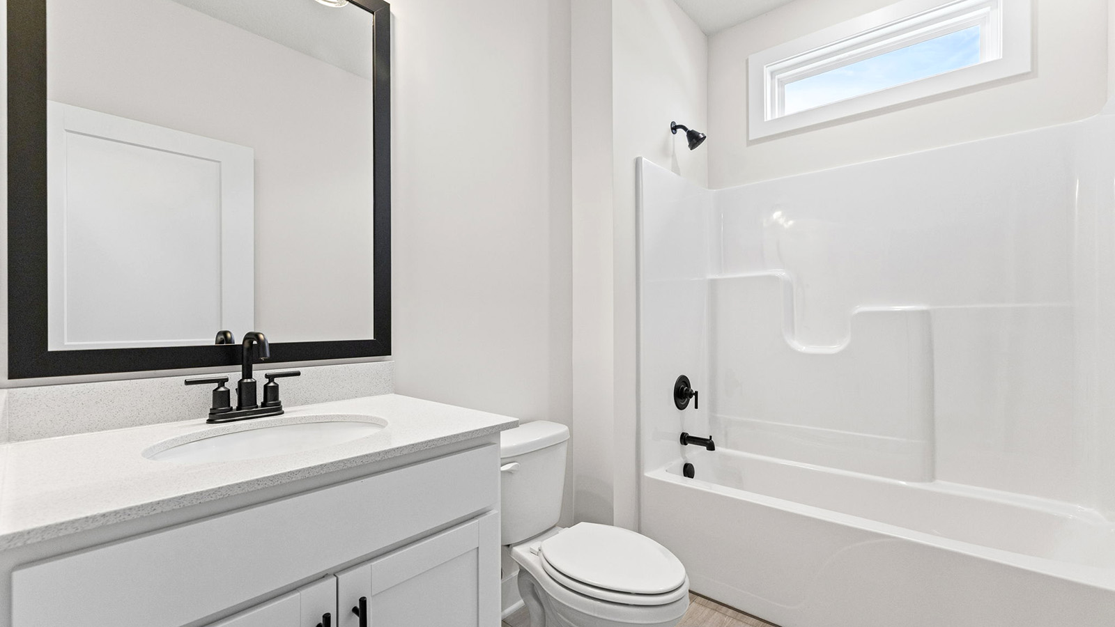 Bathroom with a bathtub shower combination