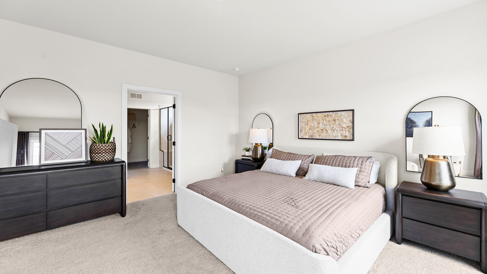 Primary bedroom with carpet, and two large windows