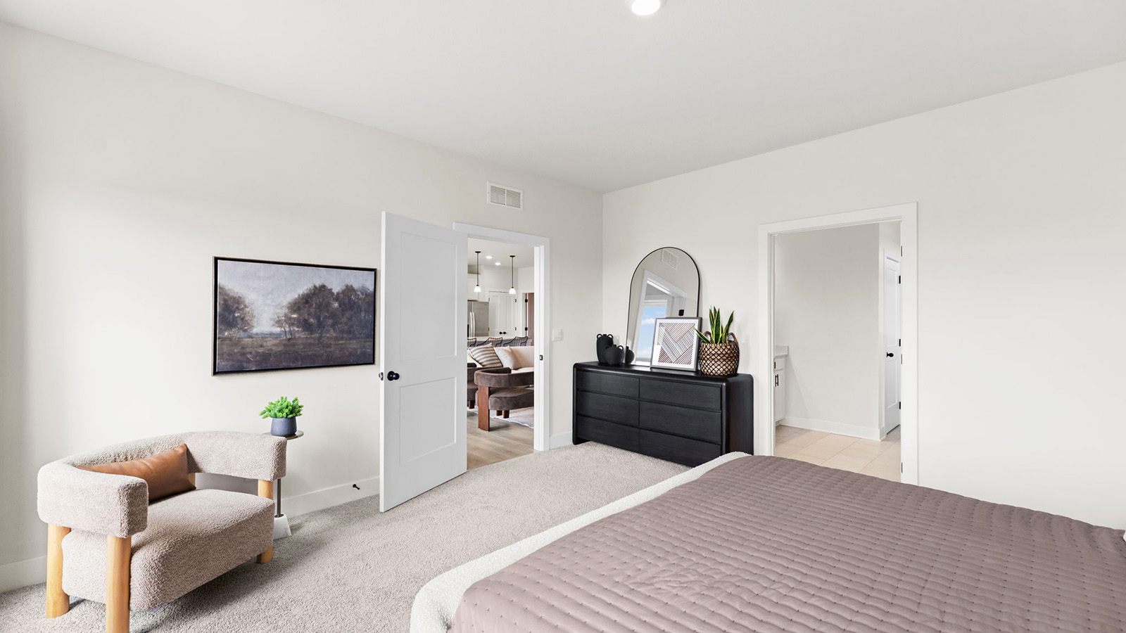 Primary bedroom with carpet, and two large windows