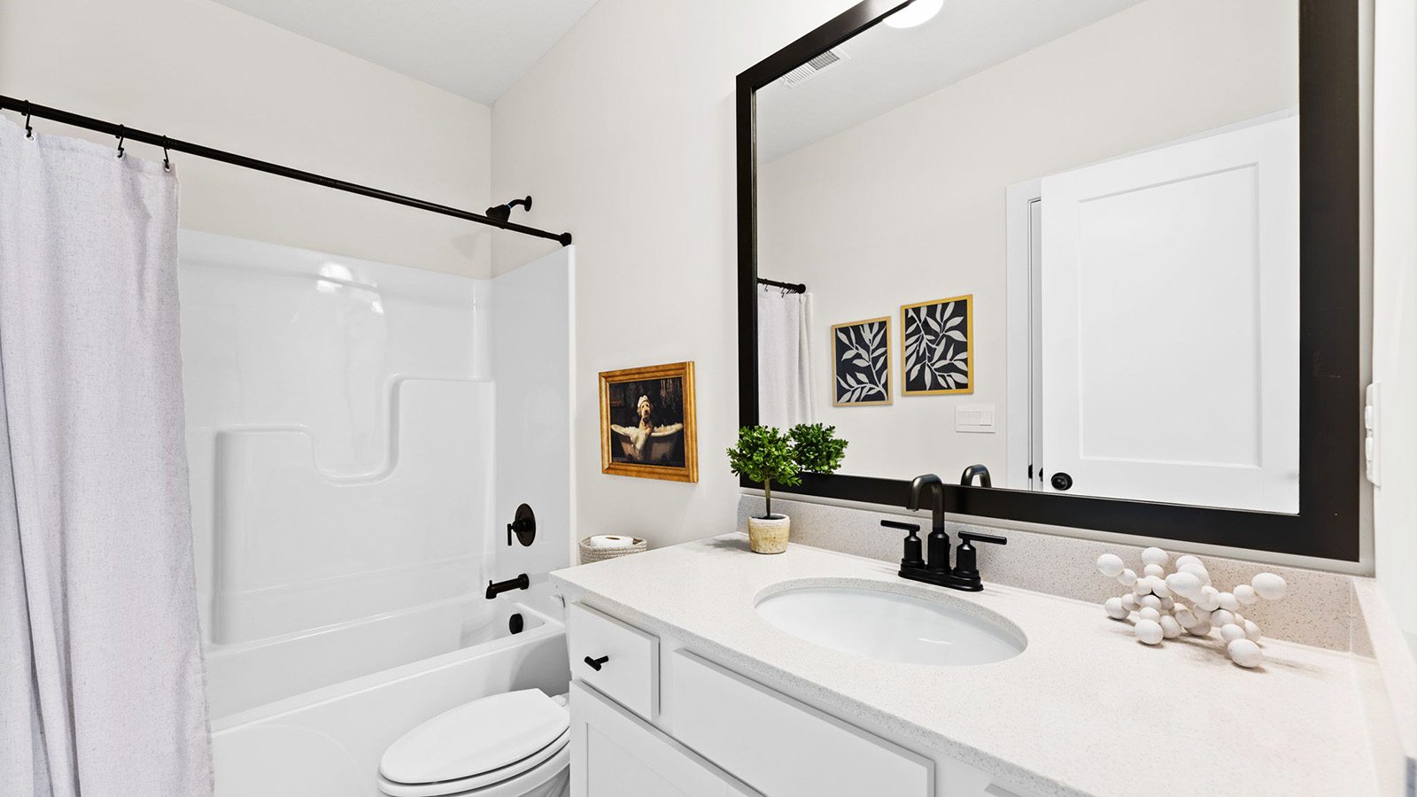 Bathroom with a bathtub shower combination