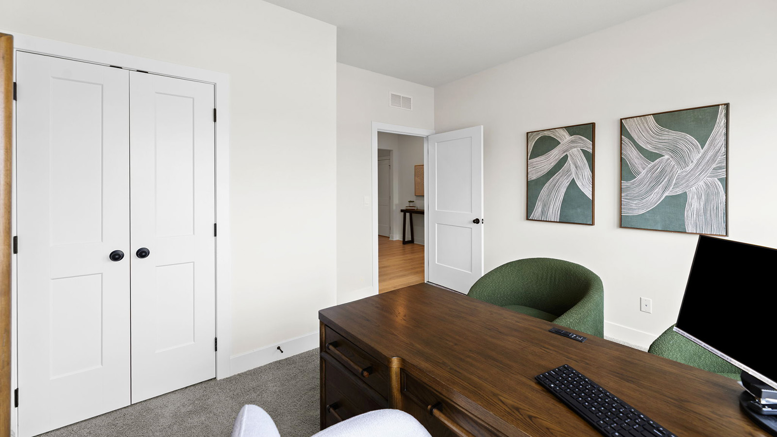 Carpeted bedroom with large window