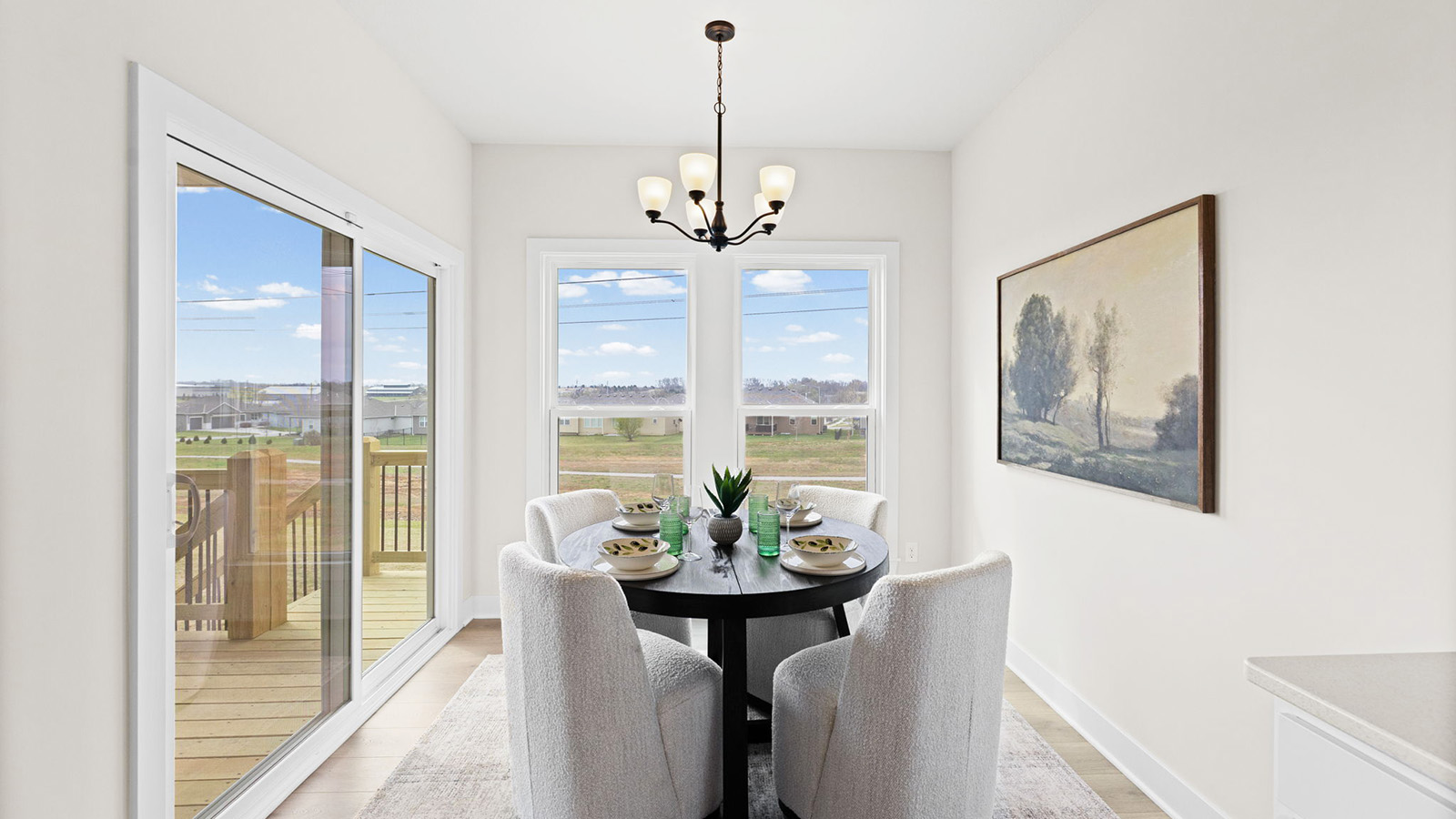 Breakfast nook off of kitchen with glass sliding door