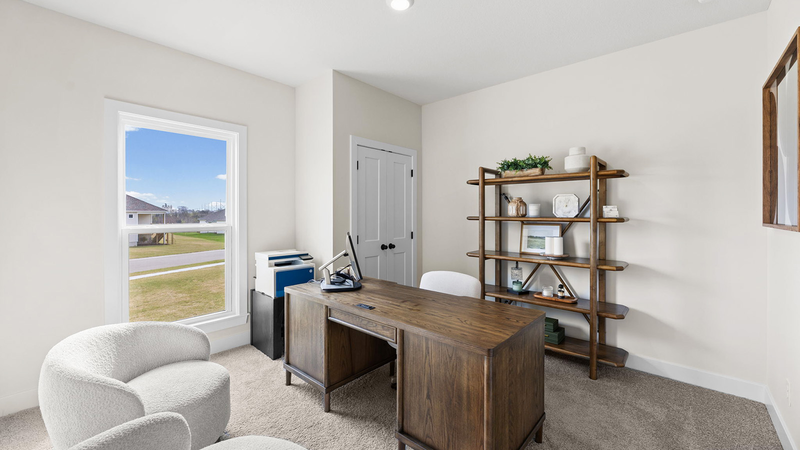 Carpeted bedroom with large window