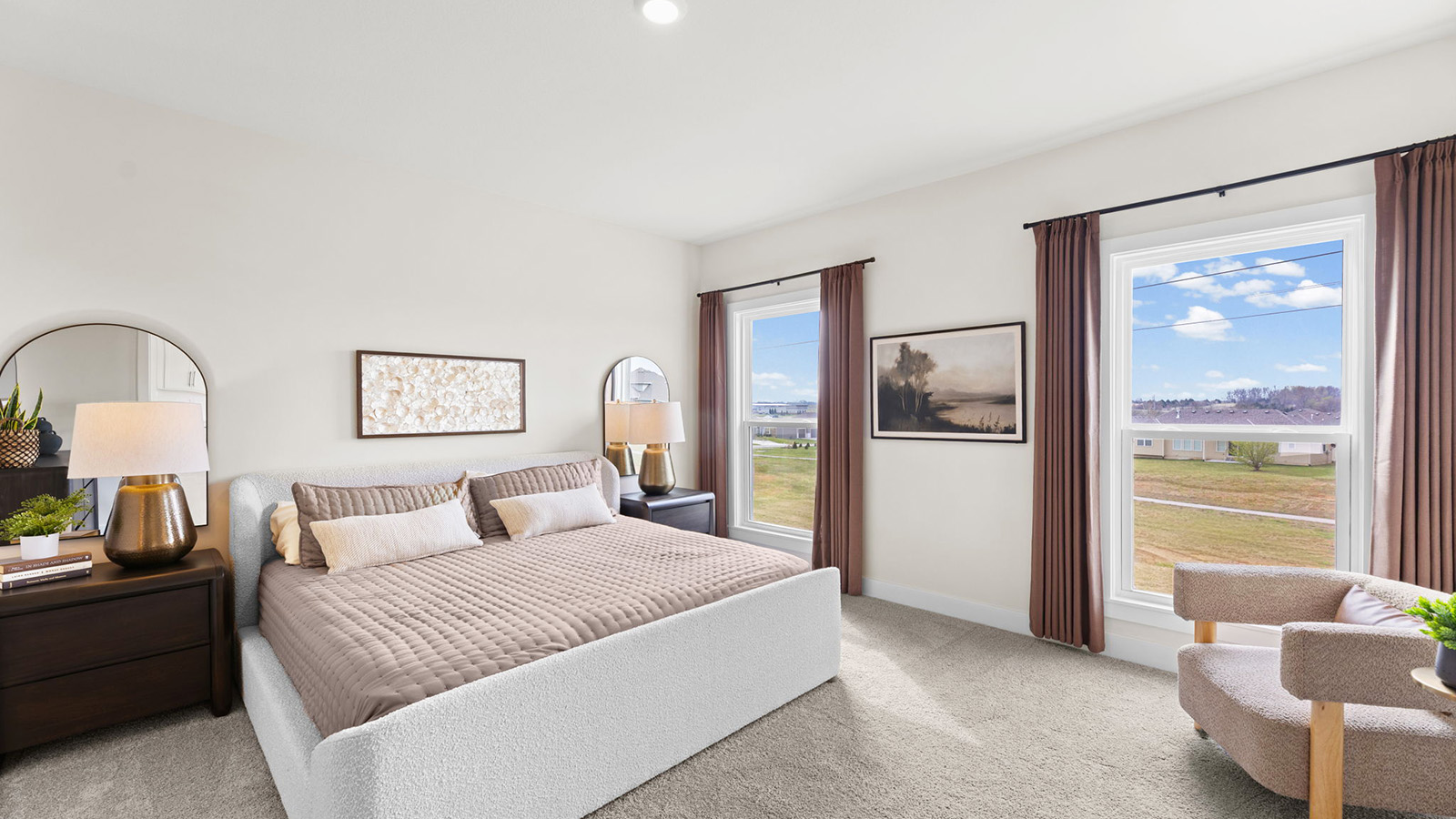Primary bedroom with carpet, and two large windows