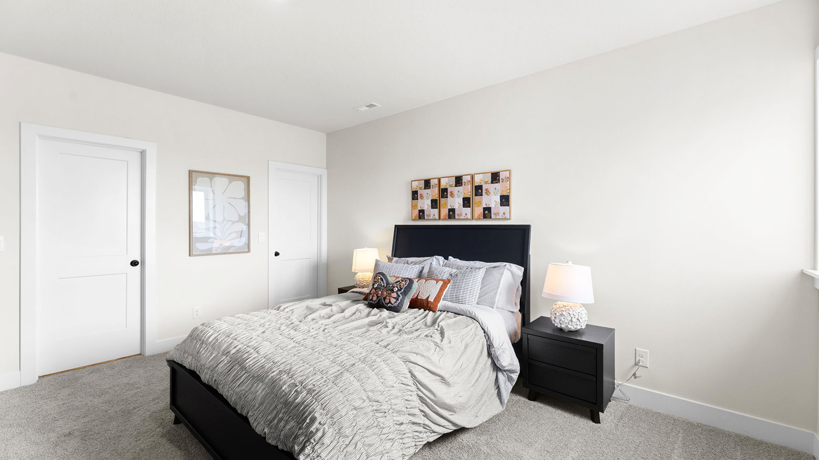 Carpeted bedroom with large window