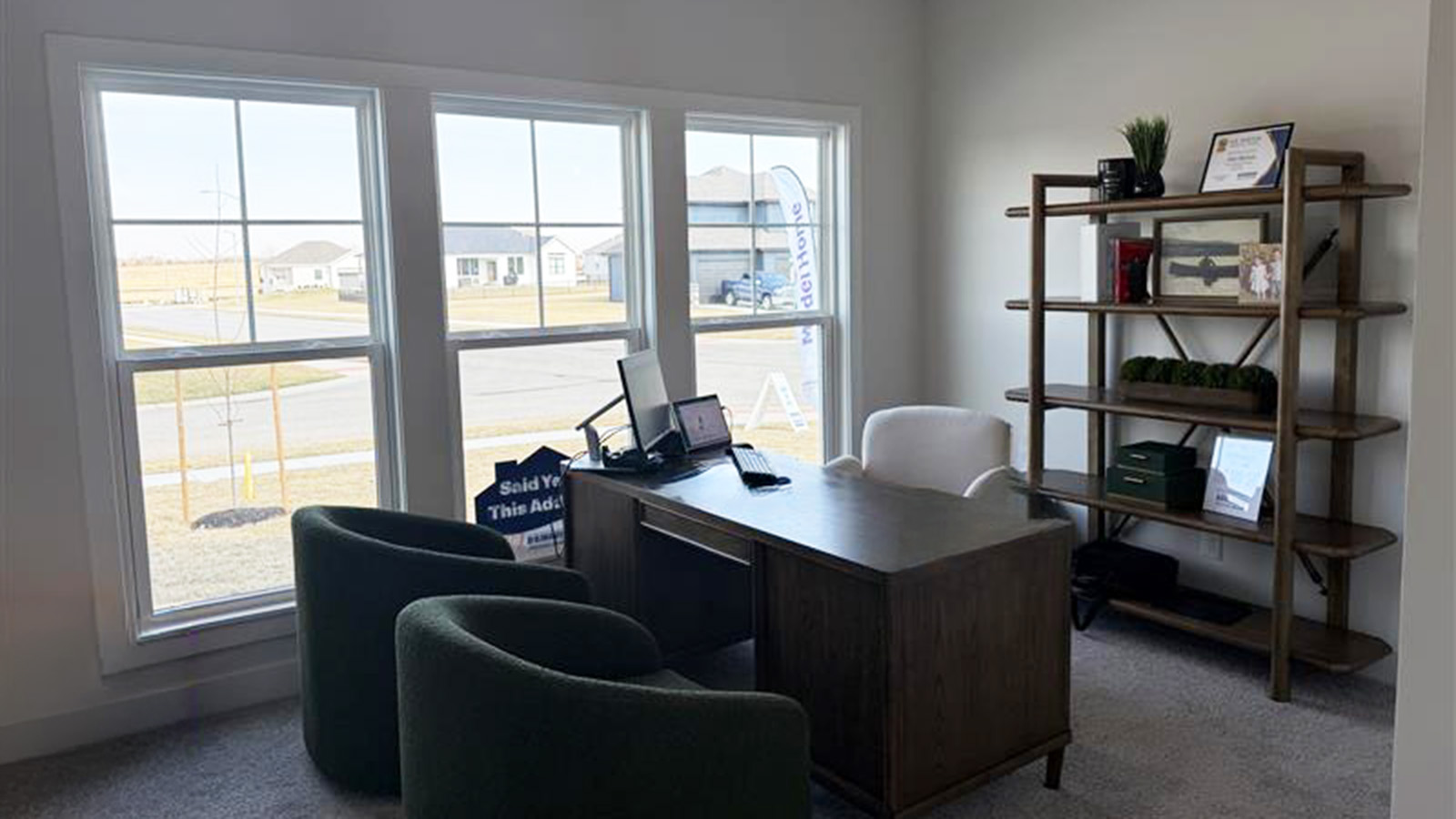 Carpeted bedrooms with large windows and closet