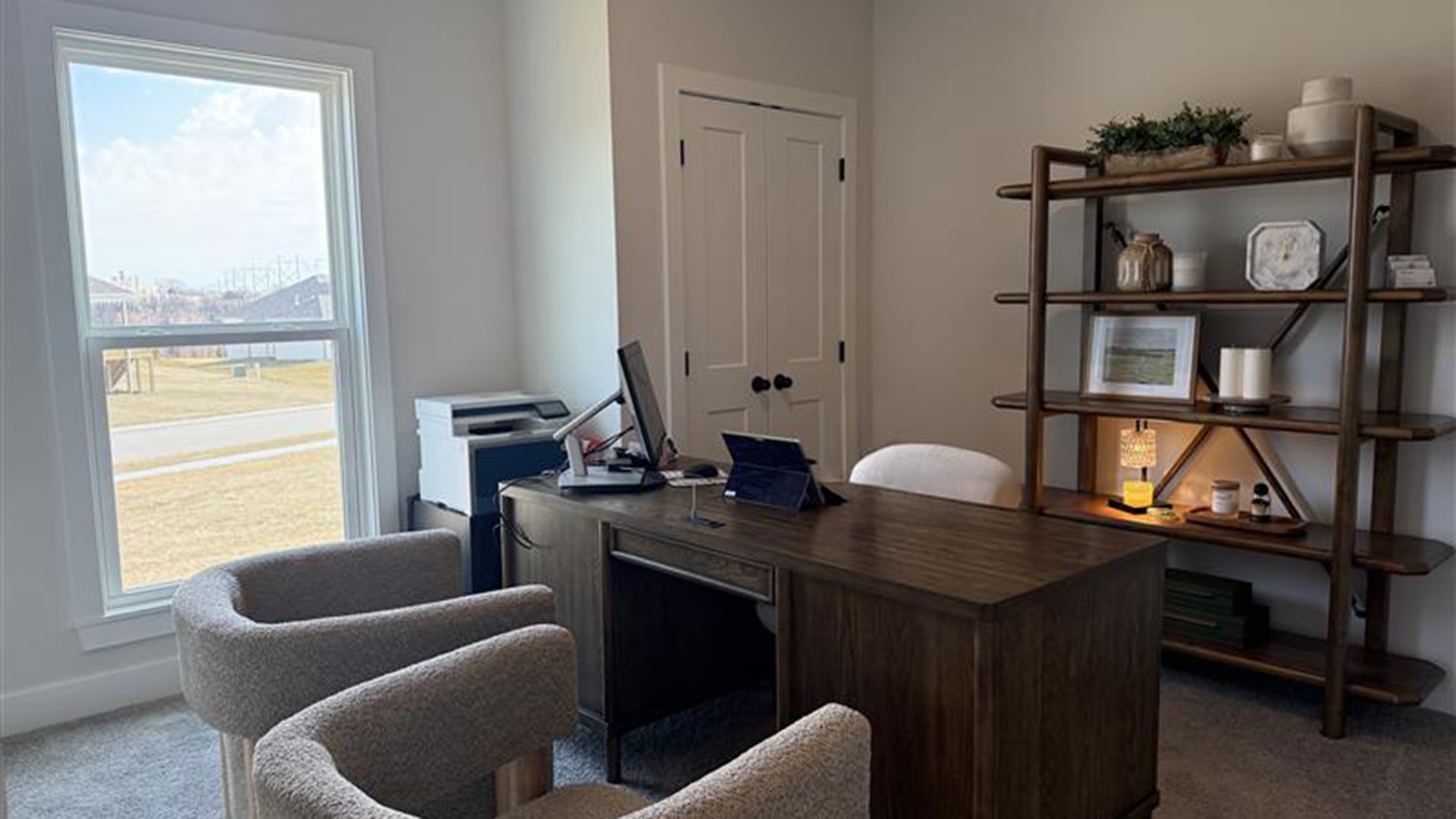 Carpeted bedrooms with large windows and closet