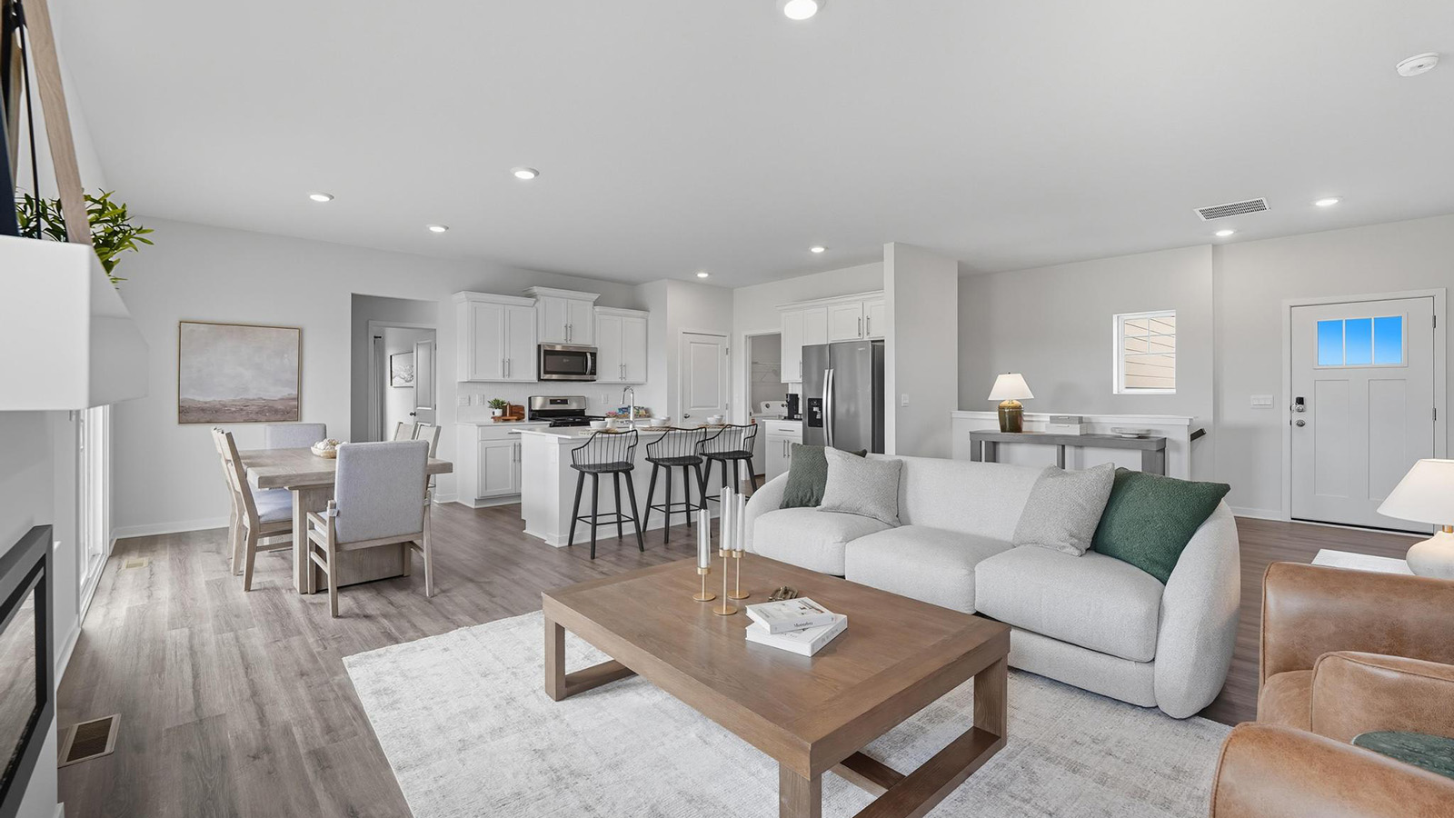 Living room with electric fireplace, and large windows