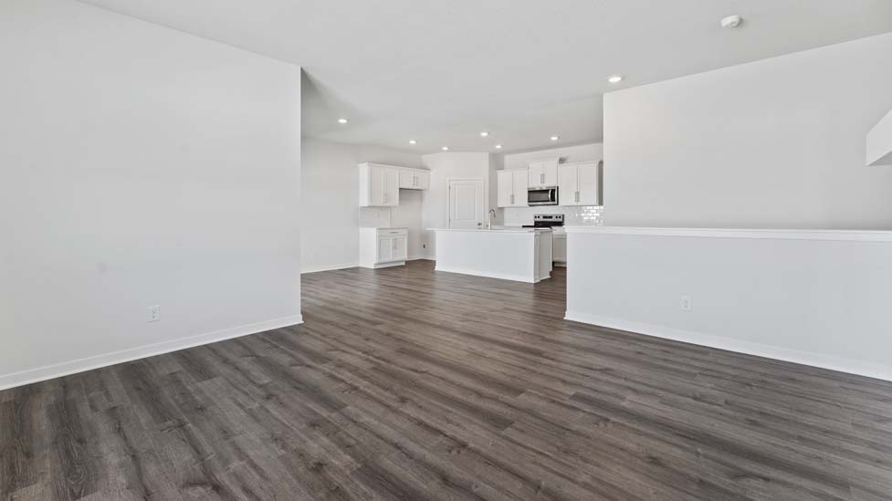 Living area with large windows and fireplace
