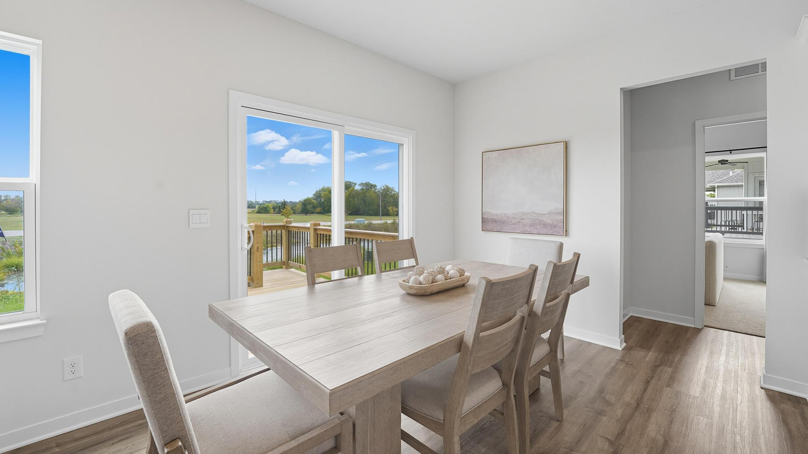Dining area beside kitchen with sliding glass back door