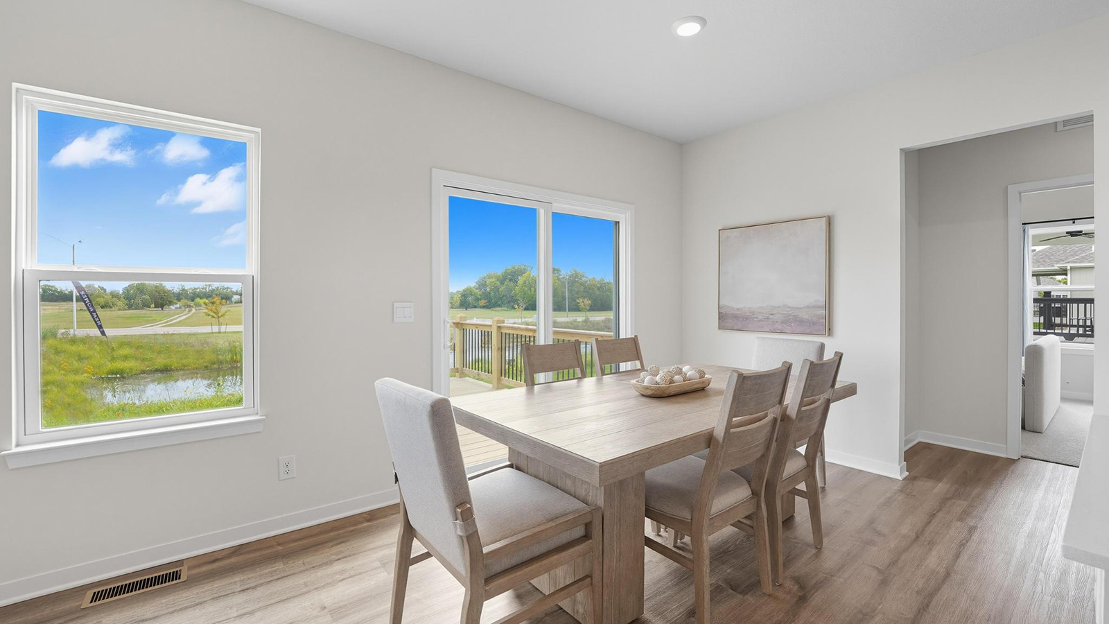 Breakfast area beside kitchen with sliding glass back door.
