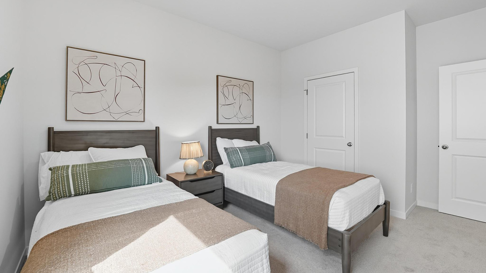 Carpeted bedroom with large windows