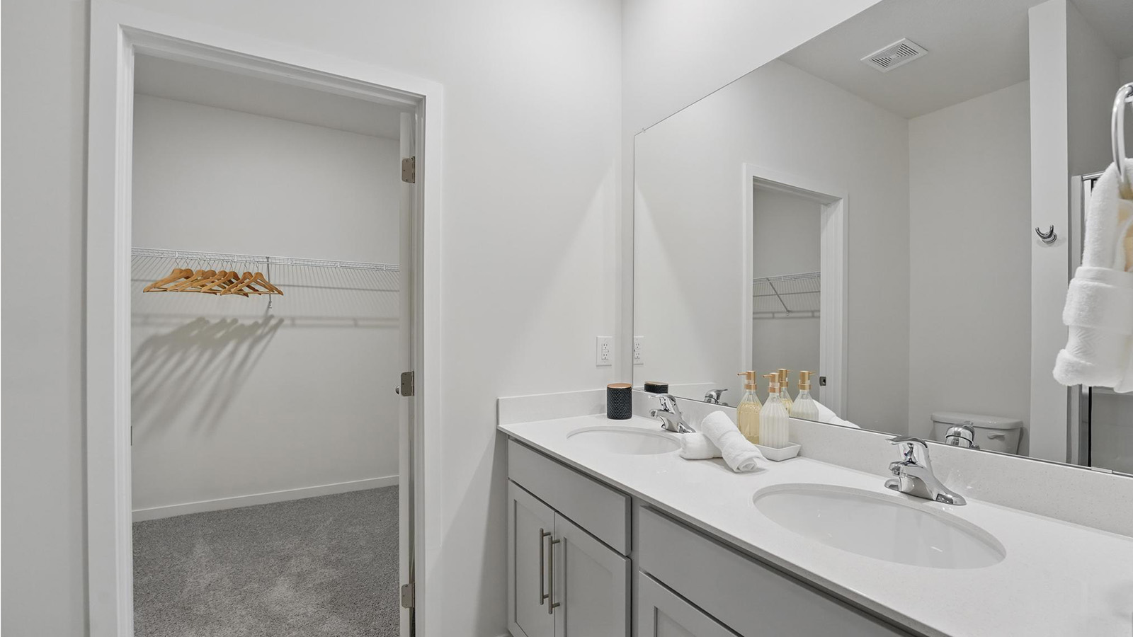 Primary bathroom with standing glass Door shower. New Homes in Kansas City, Missouri