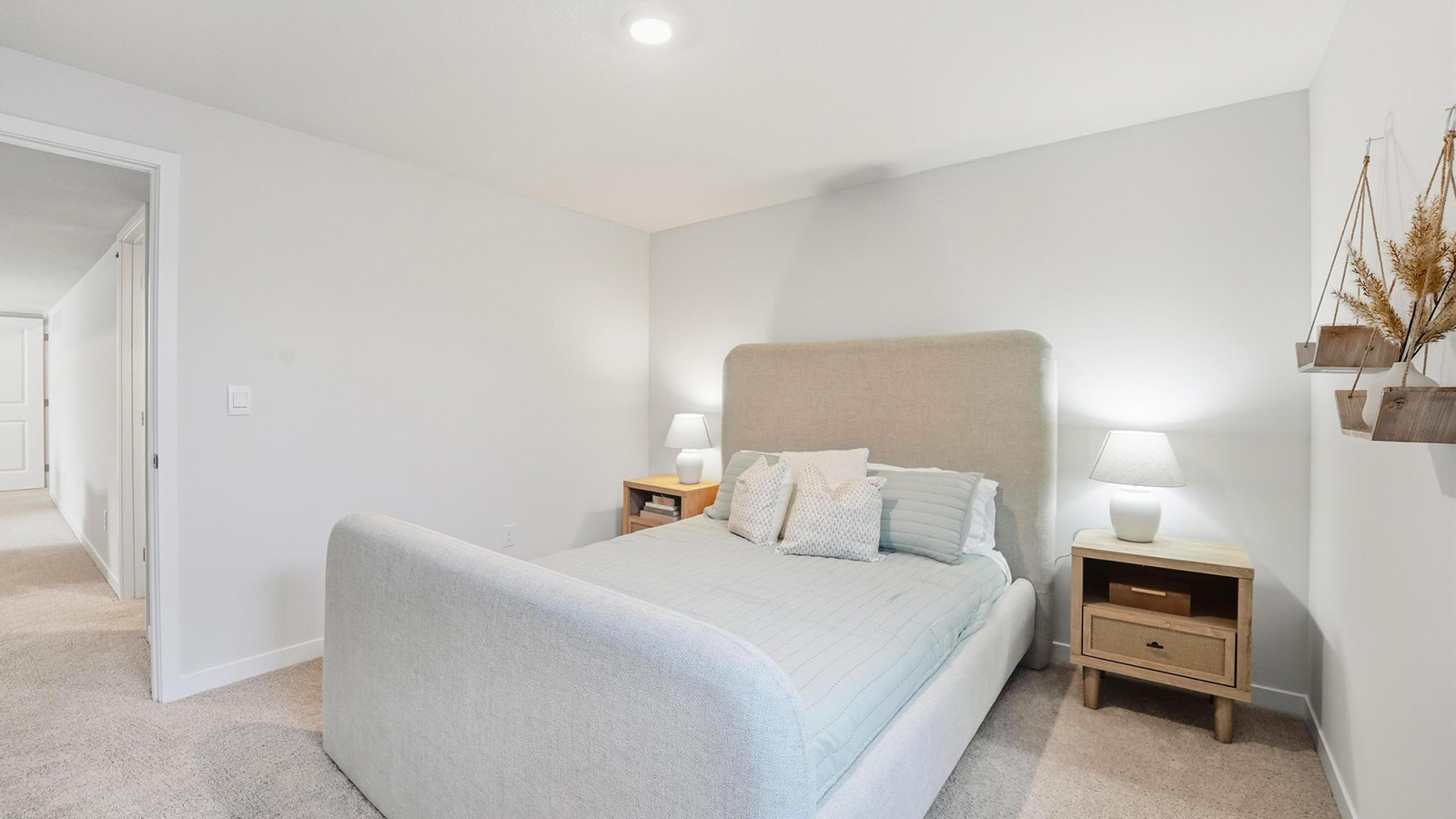 Carpeted bedroom with large window