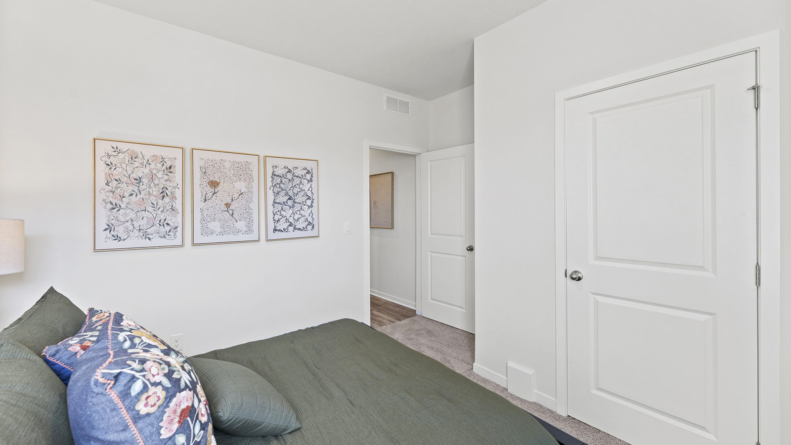 Carpeted bedroom with large window