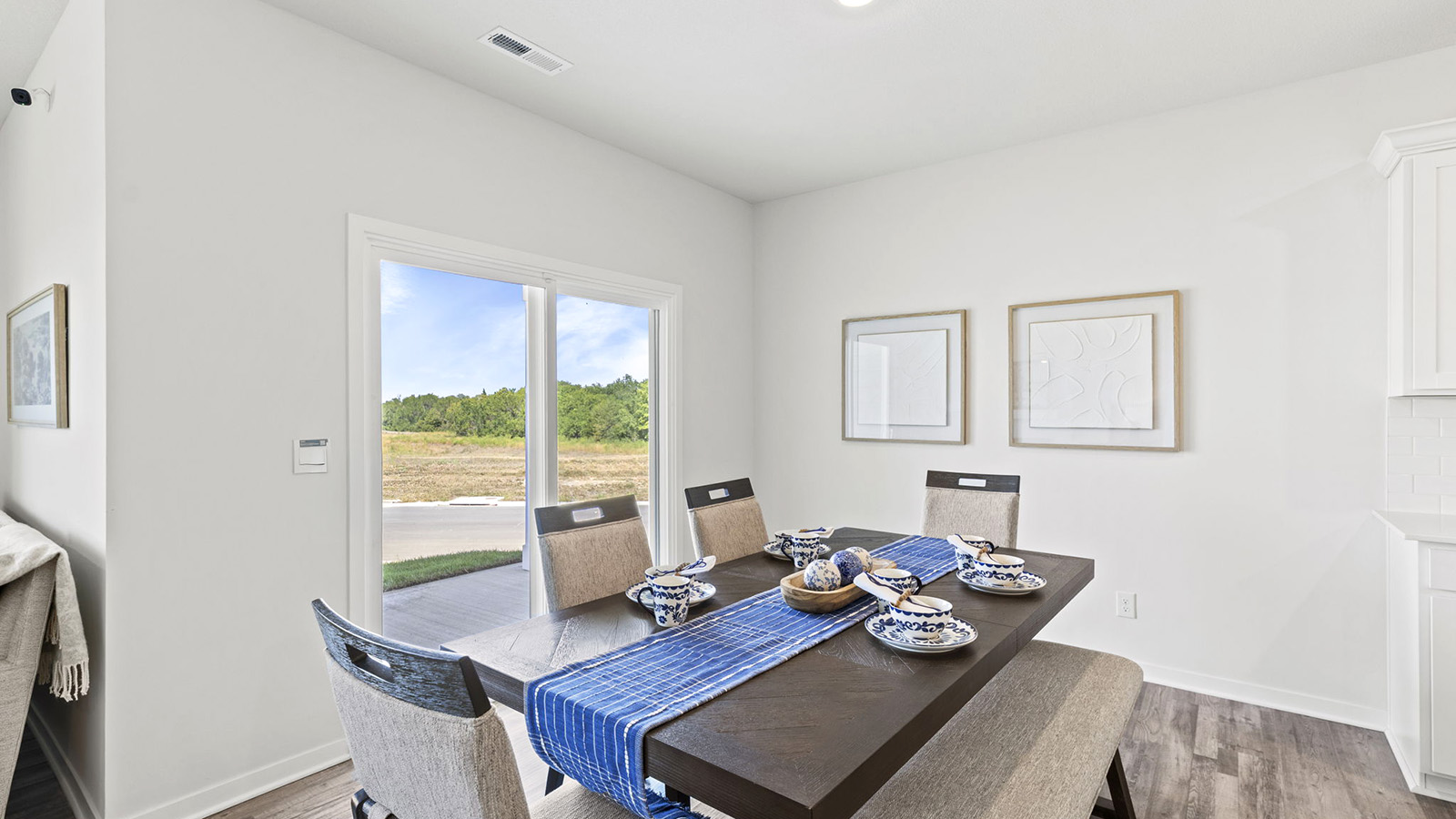 Dining area off of kitchen with glass sliding door
