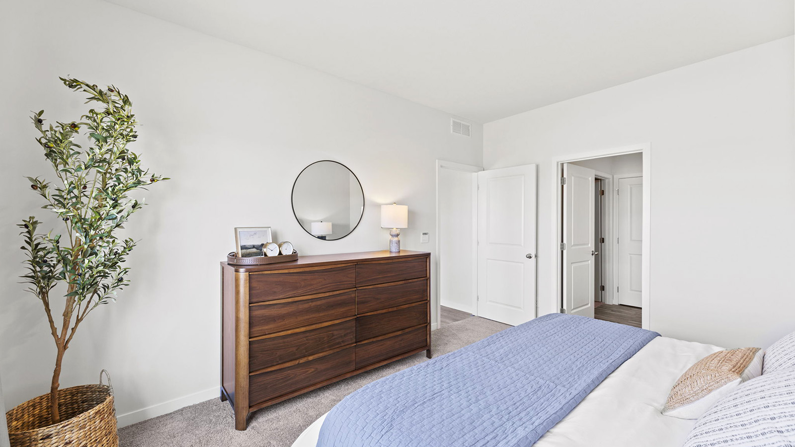 Primary bedroom with carpet, and large windows