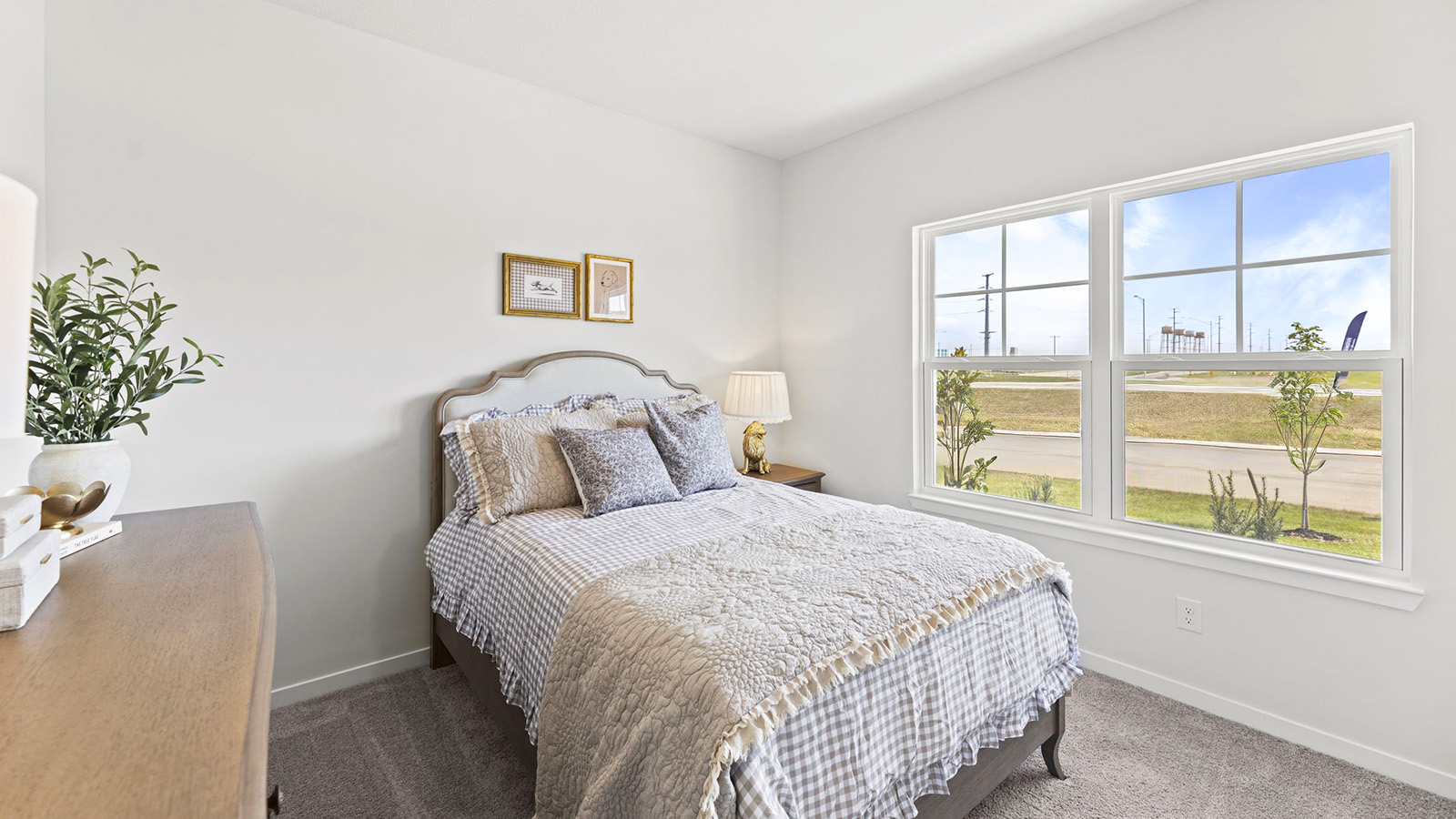 Carpeted bedroom with large window