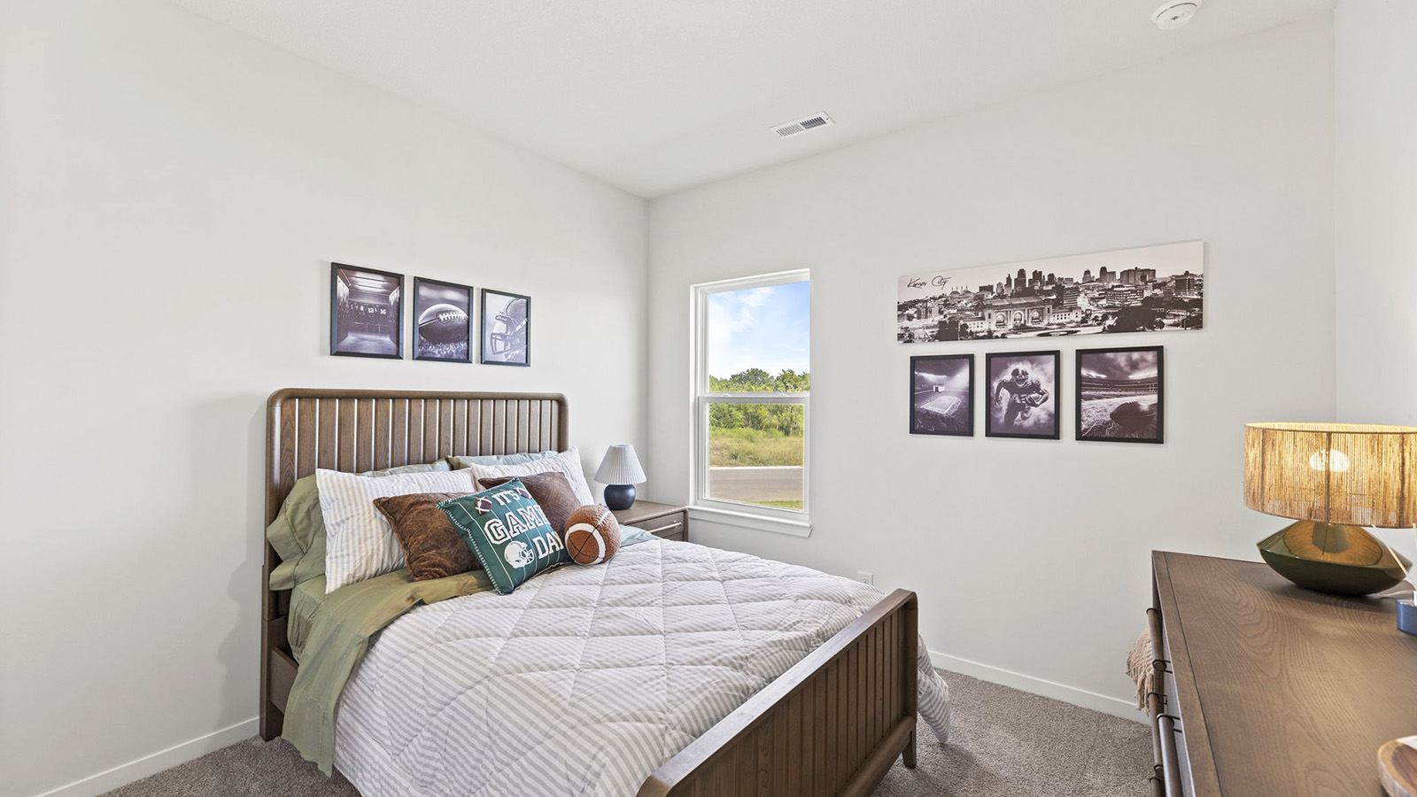 Carpeted bedroom with large window