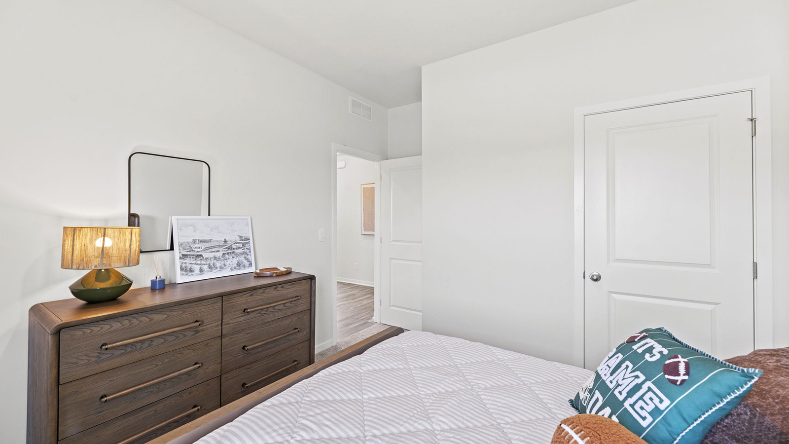 Carpeted bedroom with large window