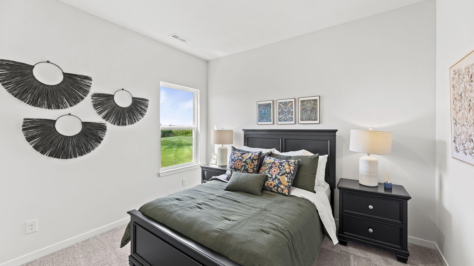 Carpeted bedroom with large window