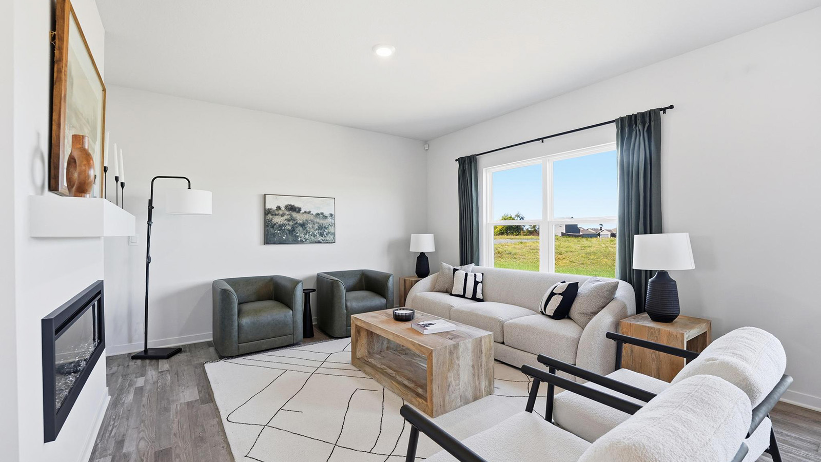 Living room with electric fireplace. New Homes in Kansas City, Missouri