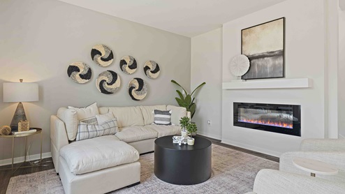 Living room with electric fireplace. New Homes in Kansas City, Missouri