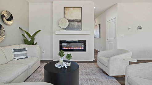 Living room with electric fireplace. New Homes in Kansas City, Missouri